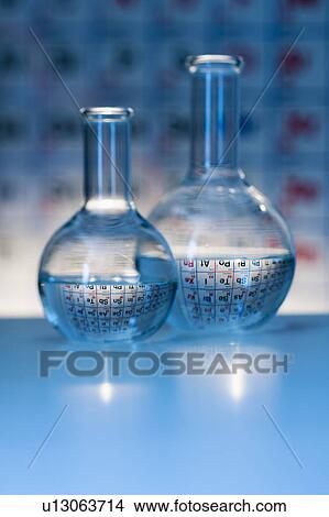 Beakers with periodic tables in laboratory View Large Photo Image Picture - Beakers with periodic tables in laboratory. Fotosearch