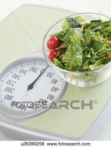 Bowl of salad on bathroom scale View Large Photo Image Stock Photo - Bowl of salad on bathroom scale. Fotosearch