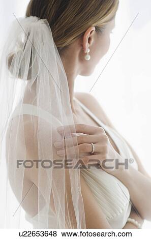 Stock Photo - Bride wearing veil. Fotosearch