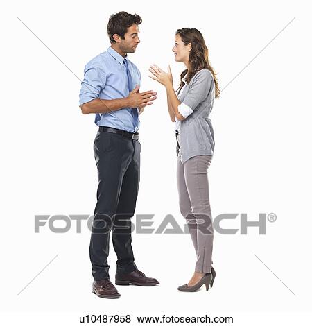 Business couple standing and having discussion View Large Photo Image Stock Photo - Business couple standing and having discussion. Fotosearch
