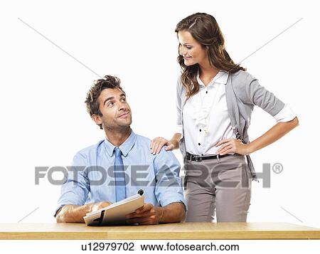 Business woman and business man reading document together View Large Photo Image Stock Image - Business woman and business man reading document together. Fotosearch
