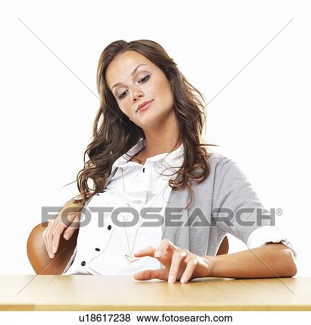 Business woman drumming table with fingers View Large Photo Image Stock Photo - Business woman drumming table with fingers. Fotosearch