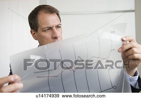 Businessman analyzing graphs View Large Photo Image Stock Photo - Businessman analyzing graphs. Fotosearch