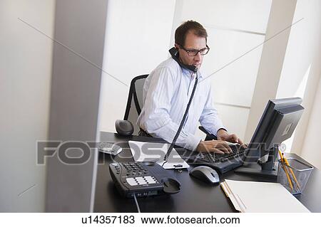 Businessman at work View Large Photo Image Stock Image - Businessman at work. Fotosearch