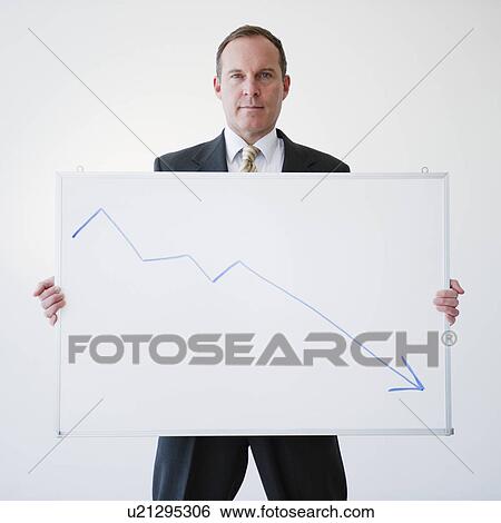 Stock Photograph - Businessman holding chart. Fotosearch