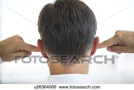 Stock Photograph - Businessman plugging ears. Fotosearch