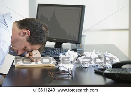 Businessman with face down on desk View Large Photo Image Stock Image - Businessman with face down on desk. Fotosearch
