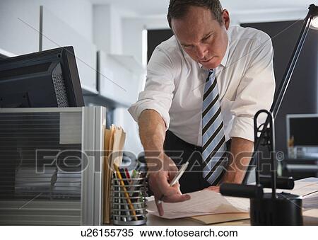 Stock Photography - Businessman working in office. Fotosearch