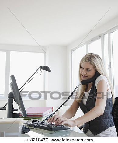 Businesswoman at work View Large Photo Image Stock Photo - Businesswoman at work. Fotosearch