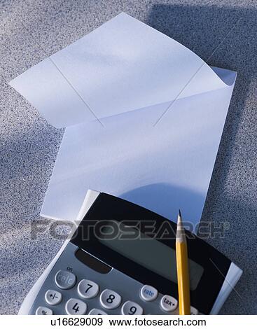 Calculator and blank paper View Large Photo Image Stock Photo - Calculator and blank paper. Fotosearch