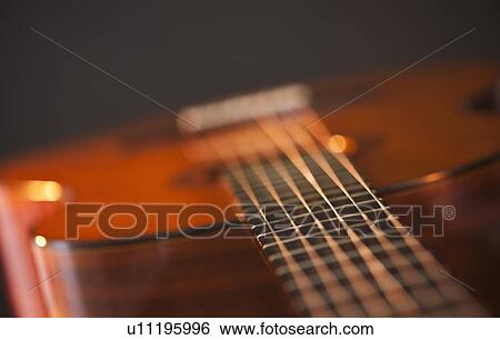 Stock Photograph - Close up of acoustic guitar. Fotosearch