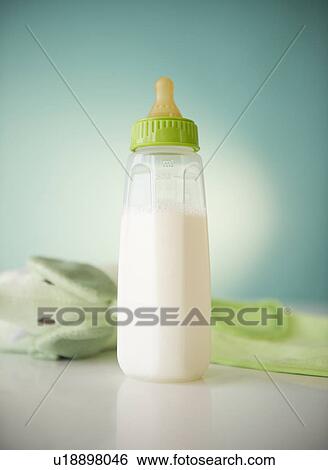 Close up of baby bottle with milk View Large Photo Image Stock Photograph - Close up of baby bottle with milk. Fotosearch