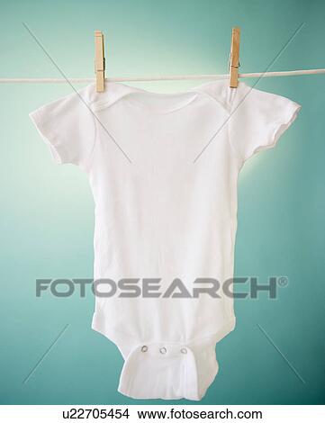 Close up of baby clothes hanging on clothesline View Large Photo Image Picture - Close up of baby clothes hanging on clothesline. Fotosearch