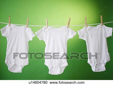 Close up of baby clothes hanging on clothesline View Large Photo Image Stock Image - Close up of baby clothes hanging on clothesline. Fotosearch
