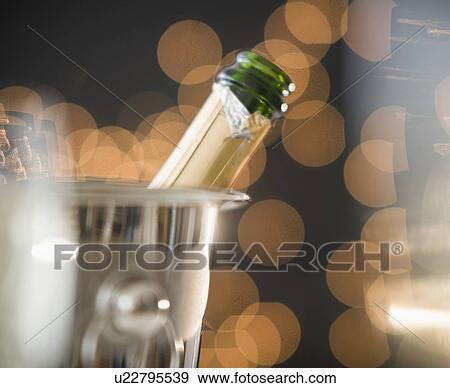 Close up of champagne in ice bucket View Large Photo Image Stock Photo - Close up of champagne in ice bucket. Fotosearch
