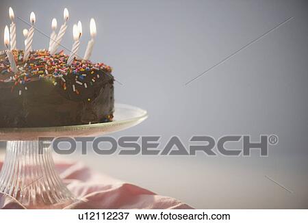 Close up of chocolate birthday cake with candles View Large Photo Image Stock Photo - Close up of chocolate birthday cake with candles. Fotosearch