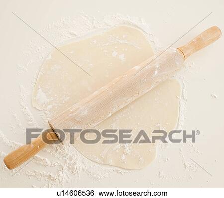 Close up of dough and roller pin View Large Photo Image Stock Photograph - Close up of dough and roller pin. Fotosearch