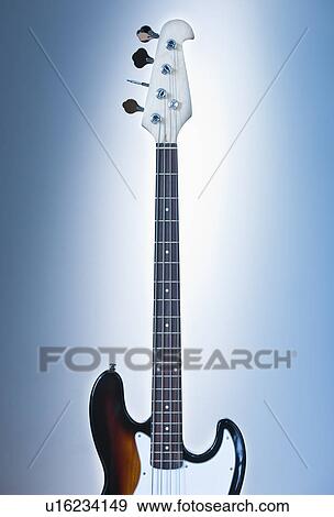 Stock Photo - Close up of electric guitar on blue backgrounds. Fotosearch