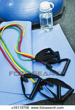 Stock Photograph - Close up of expander in gym. Fotosearch