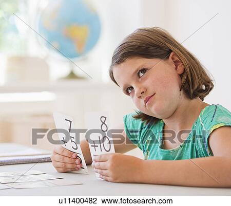 Close up of girl (6-7) counting in classroom View Large Photo Image Stock Image - Close up of girl (6-7) counting in classroom. Fotosearch