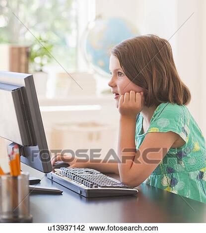 Close up of girl (6-7) using computer in classroom View Large Photo Image Stock Image - Close up of girl (6-7) using computer in classroom. Fotosearch