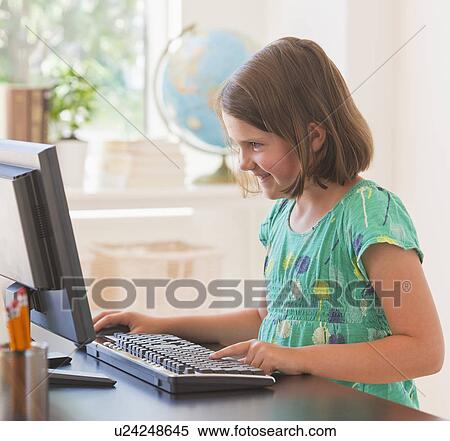 Close up of girl (6-7) using computer in classroom View Large Photo Image Stock Photography - Close up of girl (6-7) using computer in classroom. Fotosearch