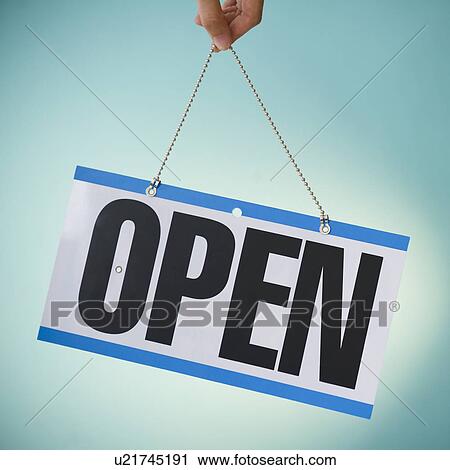 Close up of hand holding open sign View Large Photo Image Stock Image - Close up of hand holding open sign. Fotosearch