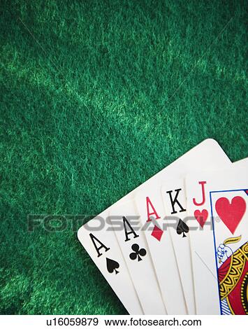 Stock Photo - Close up of hand of cards on green felt. Fotosearch