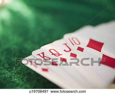 Stock Photo - Close up of hand of cards on green felt. Fotosearch