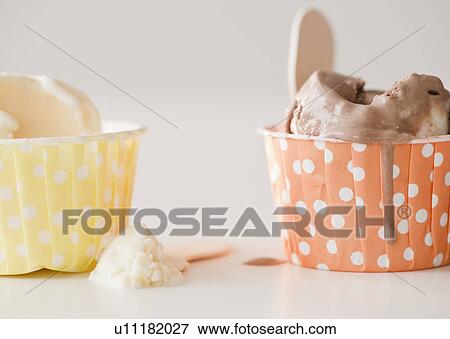 Stock Photo - Close up of ice cream in colorful cups. Fotosearch