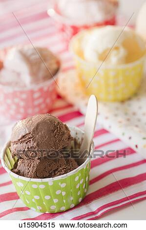 Stock Photography - Close up of ice cream in colorful cups. Fotosearch