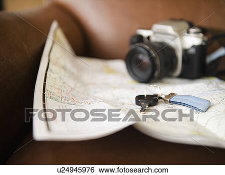 Close up of map, camera and car keys View Large Photo Image Stock Photograph - Close up of map, camera and car keys. Fotosearch