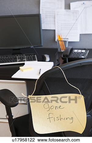Stock Image - Close up of message on office chair. Fotosearch