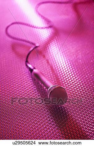Picture - Close up of microphone lying on stage. Fotosearch