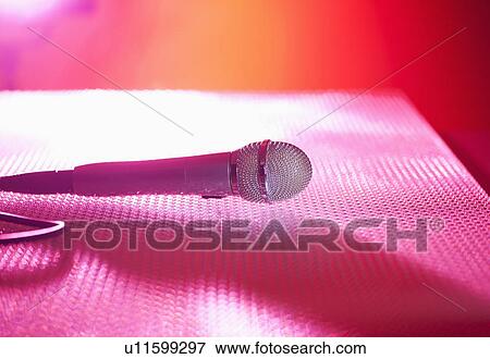 Close up of microphone lying on stage View Large Photo Image Stock Photo - Close up of microphone lying on stage. Fotosearch