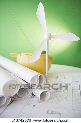 Stock Photograph - Close up of model of wind turbine and blueprints. Fotosearch