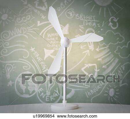 Close up of model of wind turbine against blackboard View Large Photo Image Picture - Close up of model of wind turbine against blackboard. Fotosearch