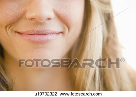 Close up of mouth of smirking woman View Large Photo Image Stock Image - Close up of mouth of smirking woman. Fotosearch