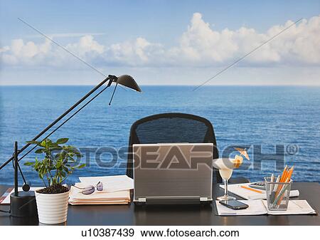 Close up of office desk with sea and sky in backgrounds View Large Photo Image Stock Photo - Close up of office desk with sea and sky in backgrounds. Fotosearch
