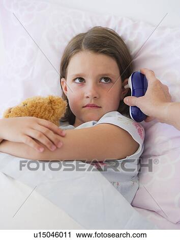 Close up of sick girl (6-7) lying in bed View Large Photo Image Stock Image - Close up of sick girl (6-7) lying in bed. Fotosearch
