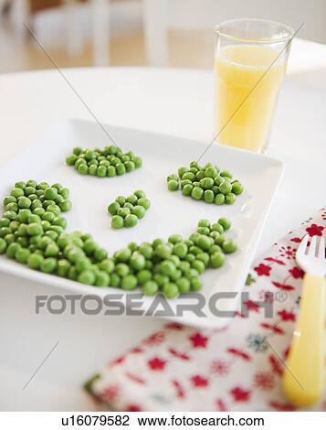 Close up of smiley on plate made of green peas View Large Photo Image Stock Image - Close up of smiley on plate made of green peas. Fotosearch
