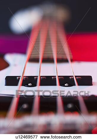 Stock Photo - Close up of strings of bass guitar. Fotosearch