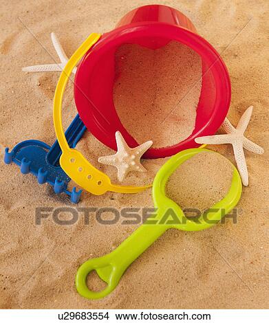 Close up of toys on sand View Large Photo Image Picture - Close up of toys on sand. Fotosearch