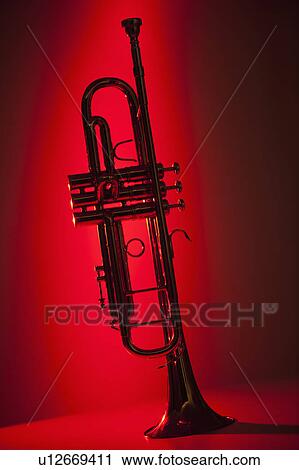 Close up of trumpet on red background View Large Photo Image Stock Image - Close up of trumpet on red background. Fotosearch