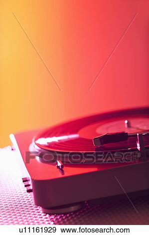 Stock Photo - Close up of turntable on colored background. Fotosearch