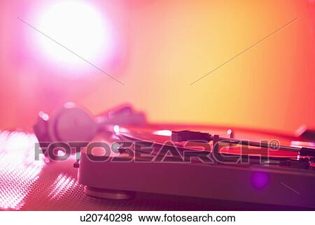 Stock Photo - Close up of turntable on colored background. Fotosearch