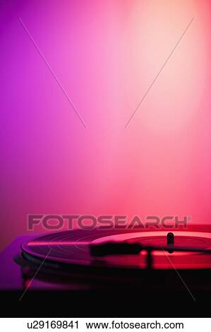 Close up of turntable on pink background View Large Photo Image Stock Image - Close up of turntable on pink background. Fotosearch