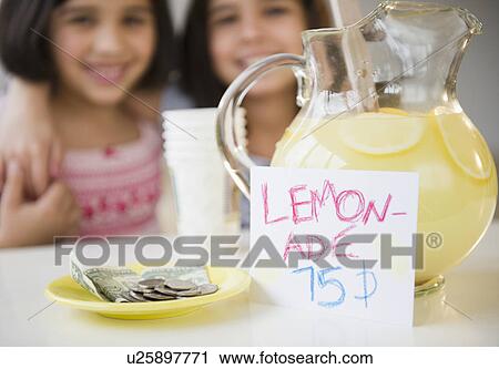 Close up of two girl's (8-9, 10-11) selling lemonade View Large Photo Image Stock Image - Close up of two girl's (8-9, 10-11) selling lemonade. Fotosearch