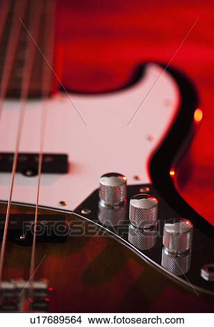 Picture - Close up of volume knobs of bass guitar. Fotosearch