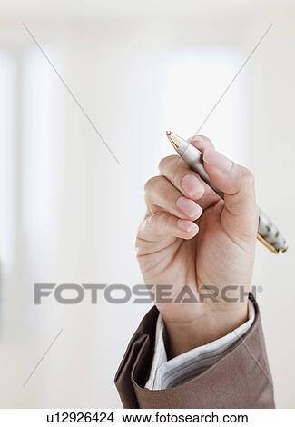 Close up of woman's hand holding pen View Large Photo Image Picture - Close up of woman's hand holding pen. Fotosearch